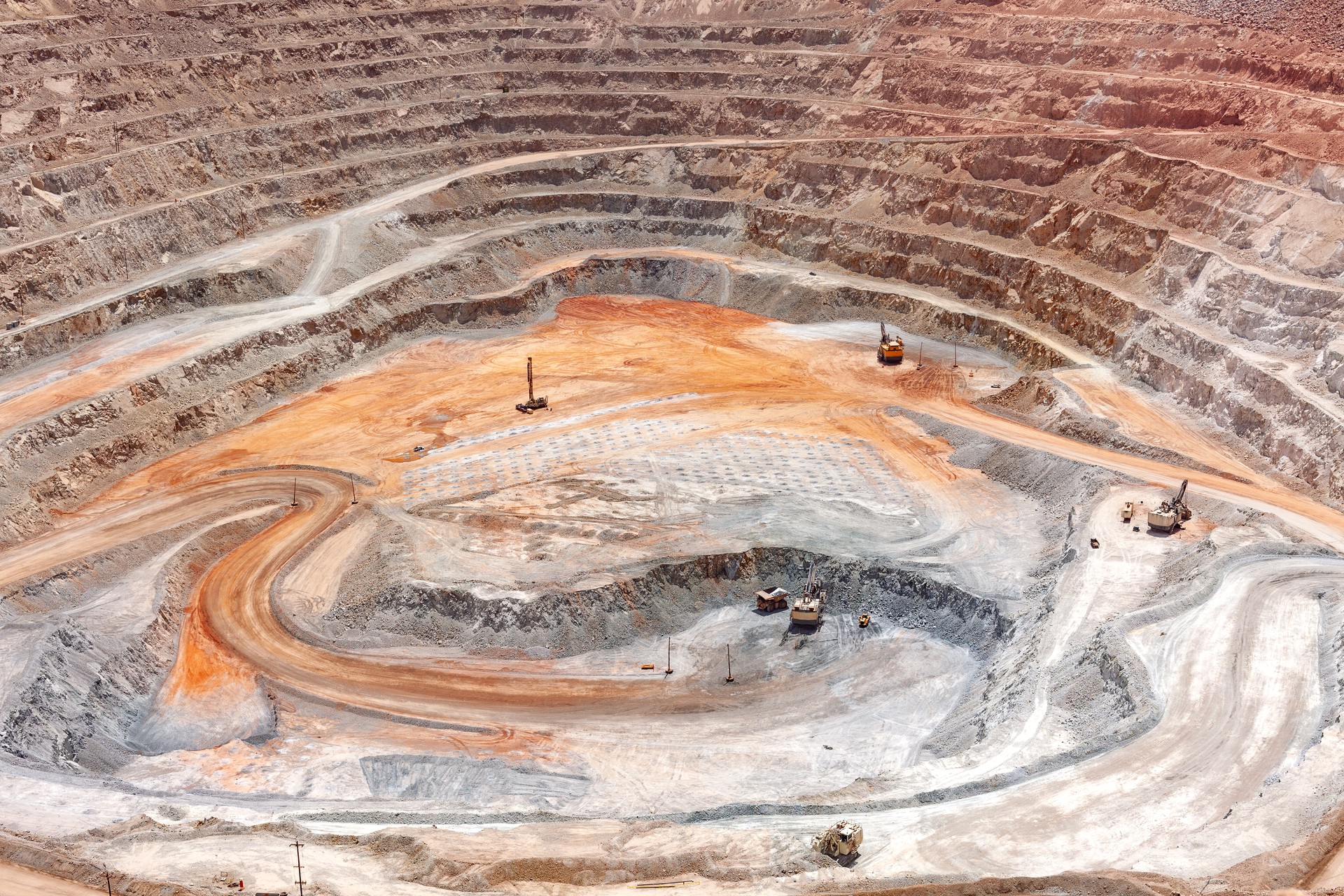 View from above of the pit of an open-pit copper mine in Peru